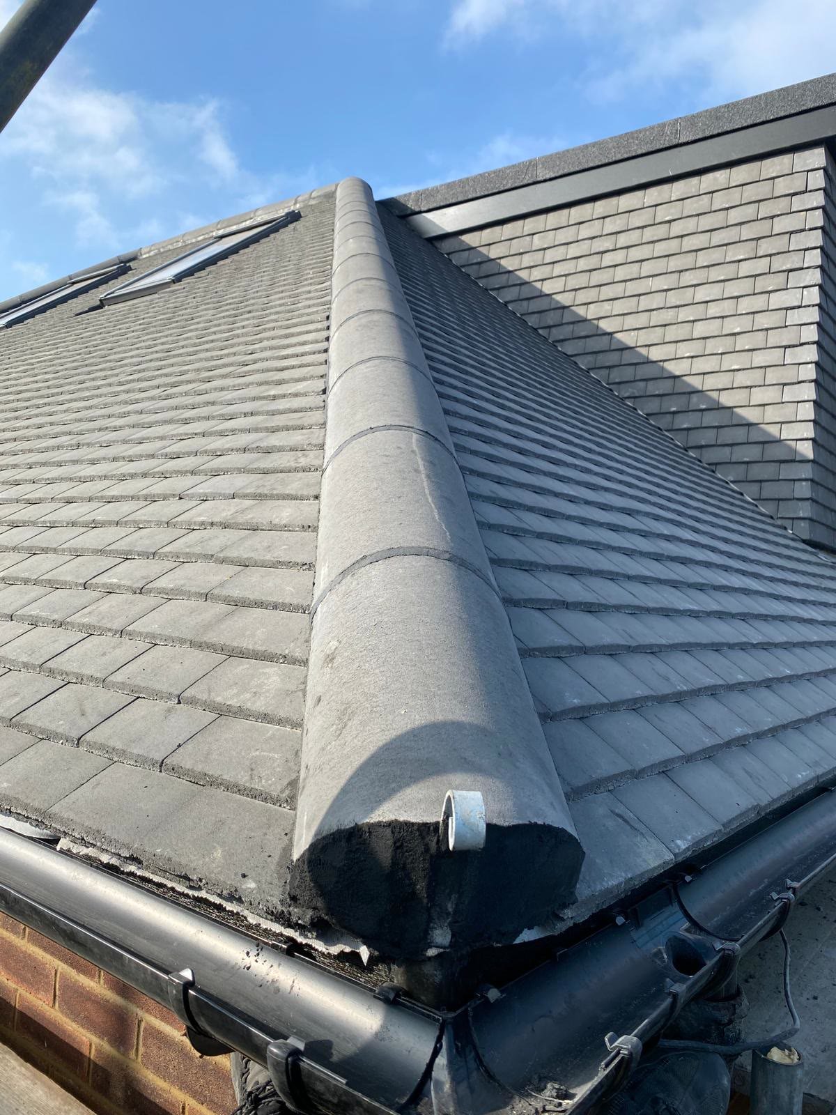 Close-up of a new hip ridge finished neatly at the gutter